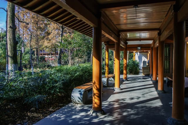 A serene nighttime scene of a small village by the water under a starry sky with the Milky Way visible